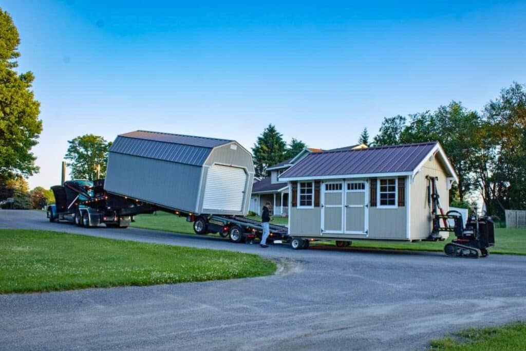 Barn shed on trailer during delivery