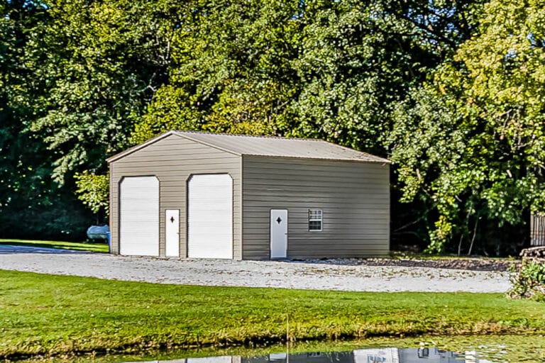 Tall tan steel garage with two white roll-up doors and side entrances